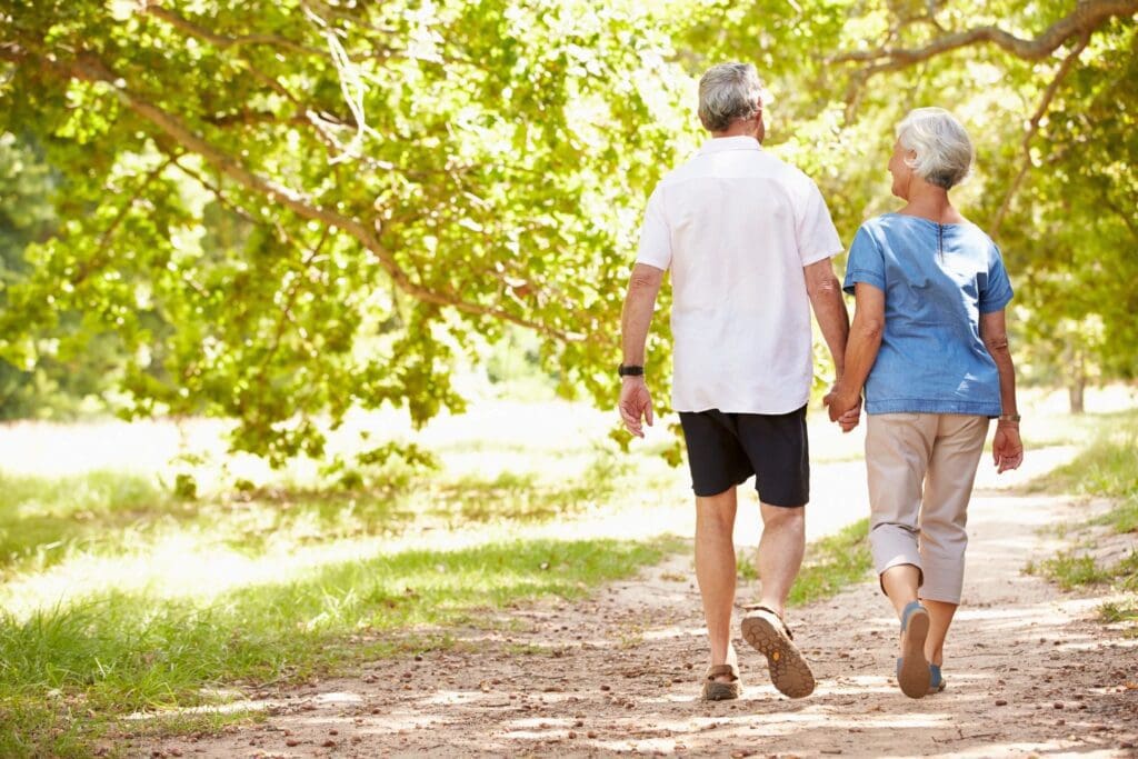 A man and woman walking on the path